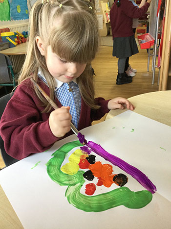 Girl painting at school club